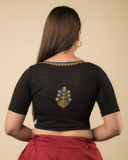  Rear view of the buti embroidered stretchable blouse showcasing the back design.
