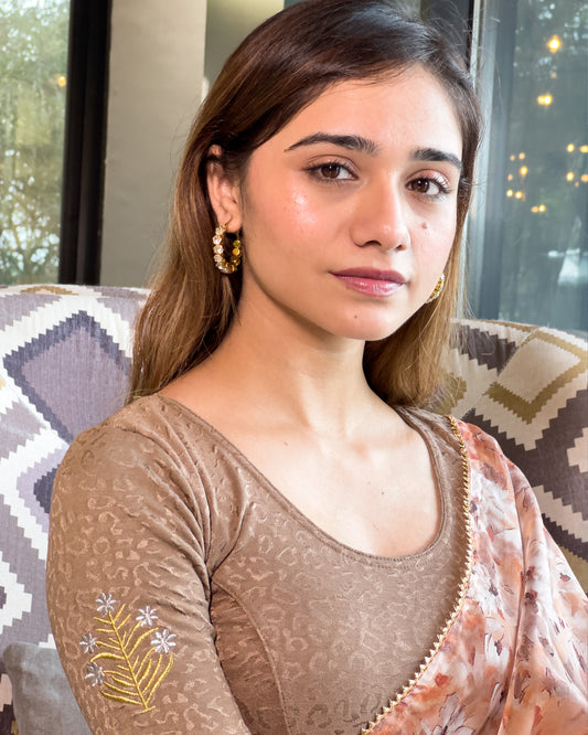 Model pairing the buti embroidered stretchable blouse with a traditional saree, demonstrating a complete ethnic look.