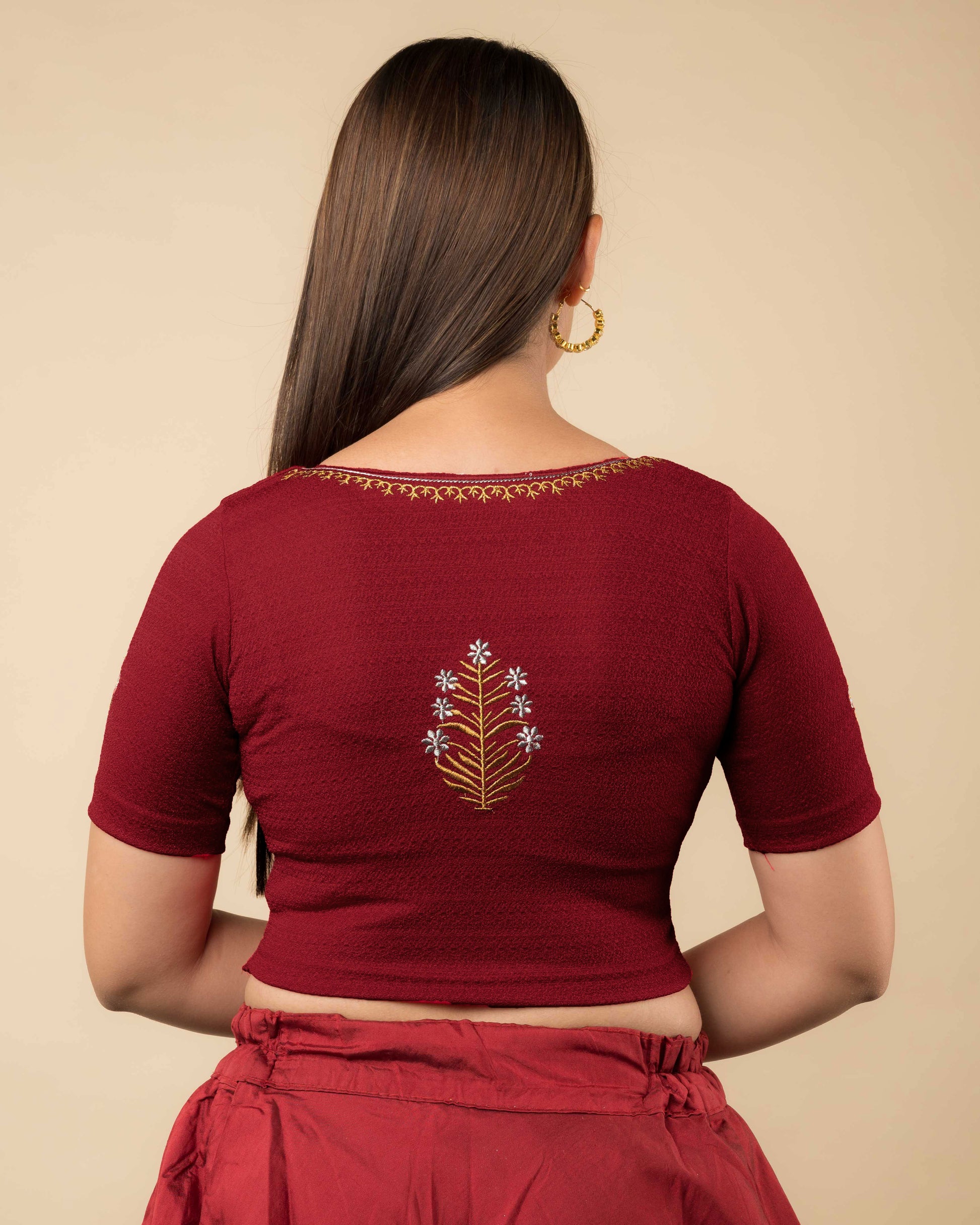  Rear view of the buti embroidered stretchable blouse showcasing the back design.