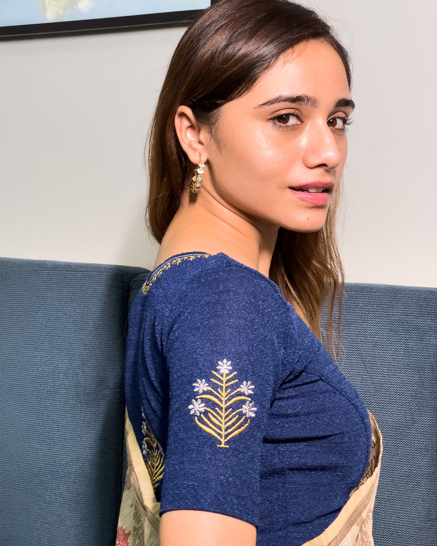 Model pairing the buti embroidered stretchable blouse with a traditional saree, demonstrating a complete ethnic look.