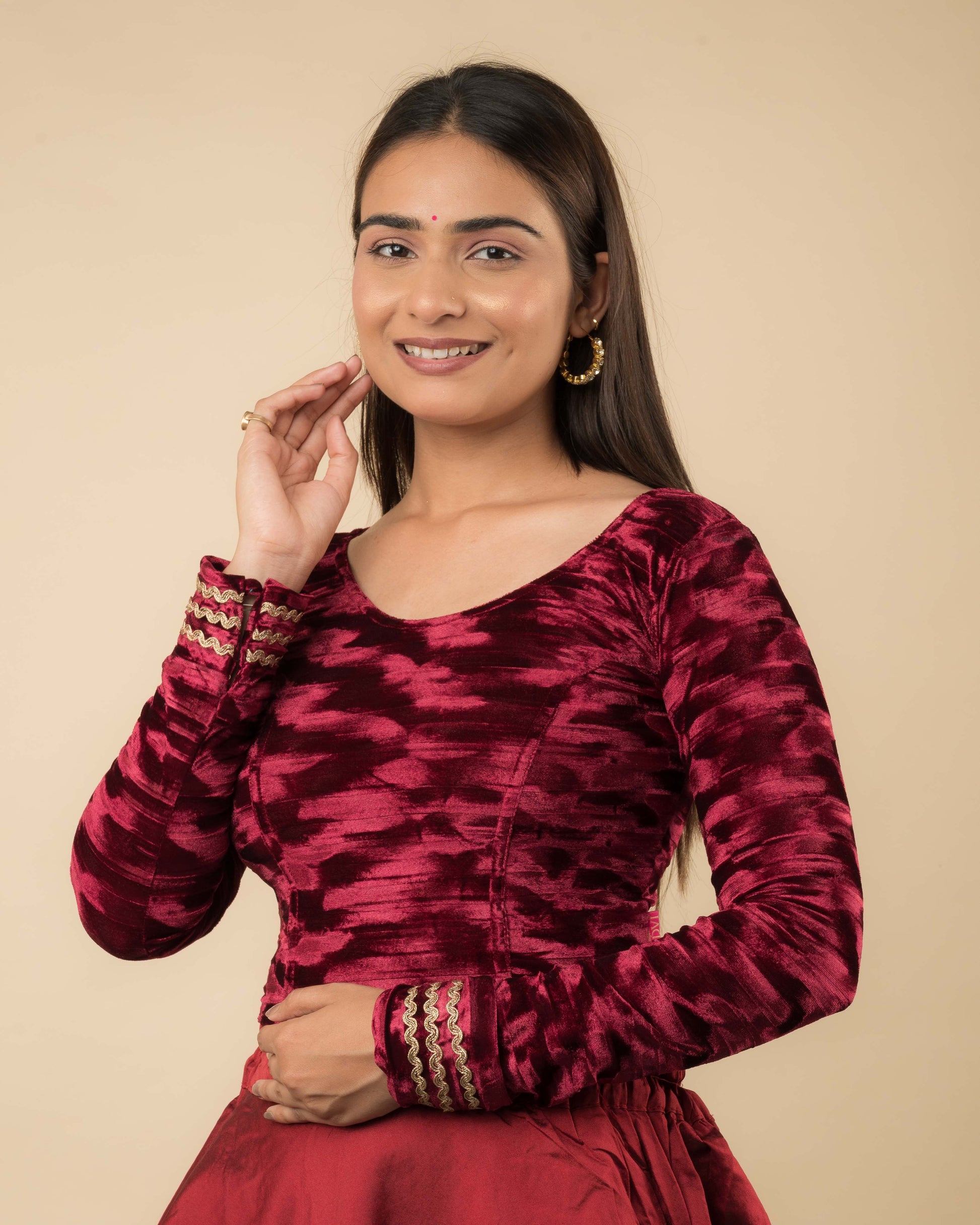 Side profile of the velvet stretchable blouse highlighting the fit and sleeve length.