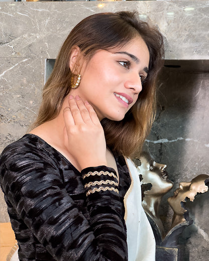 Model pairing the black velvet stretchable blouse with a traditional saree, demonstrating a complete ethnic look.