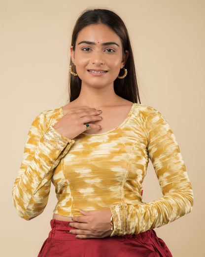 Model wearing a velvet stretchable readymade blouse with full sleeves and round neckline