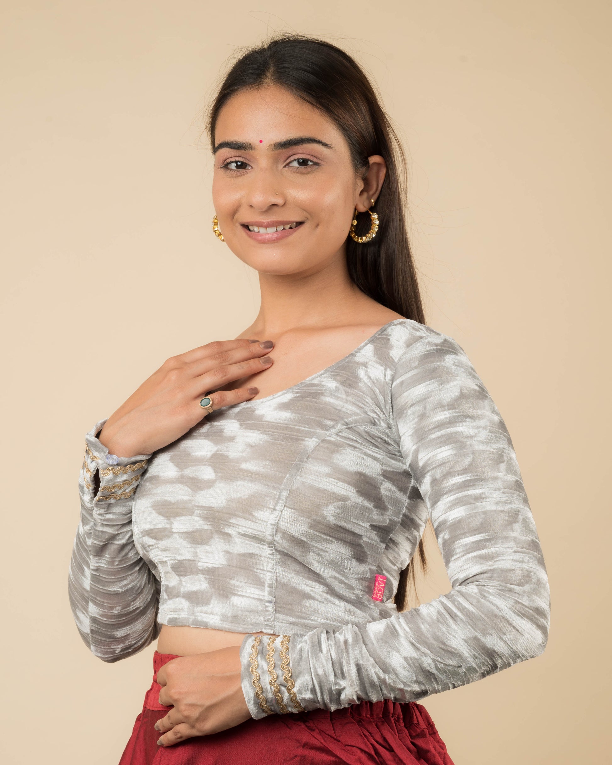 Side profile of the velvet stretchable blouse highlighting the fit and sleeve length.