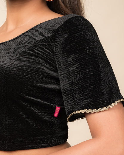Close-up of the velvet fabric detailing the lace embroidery and stretchability of the readymade blouse.