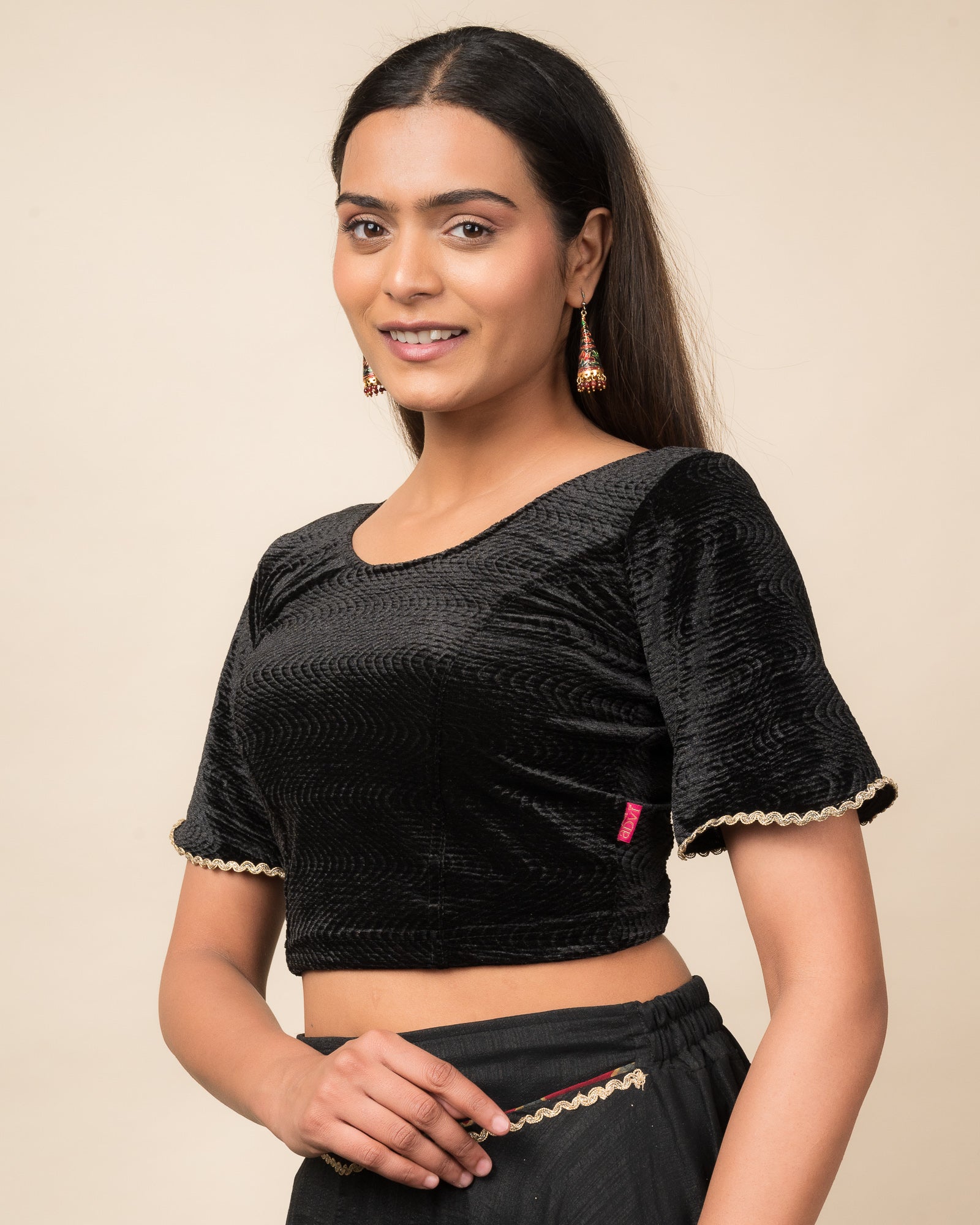 Side profile of the velvet stretchable blouse highlighting the fit and sleeve length.