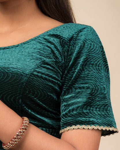 Close-up of the velvet fabric detailing the lace embroidery and stretchability of the readymade blouse.