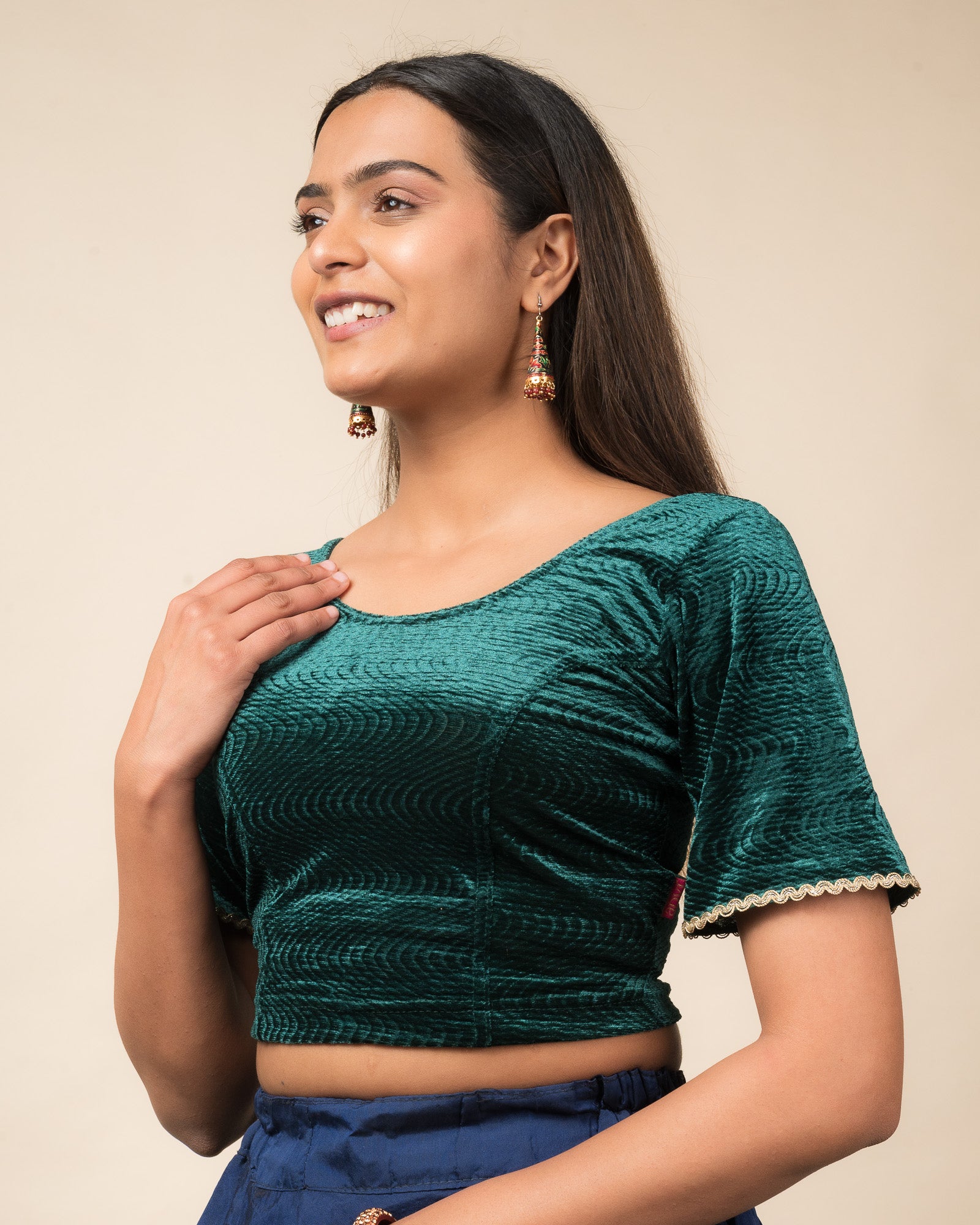 Side profile of the velvet stretchable blouse highlighting the fit and sleeve length.