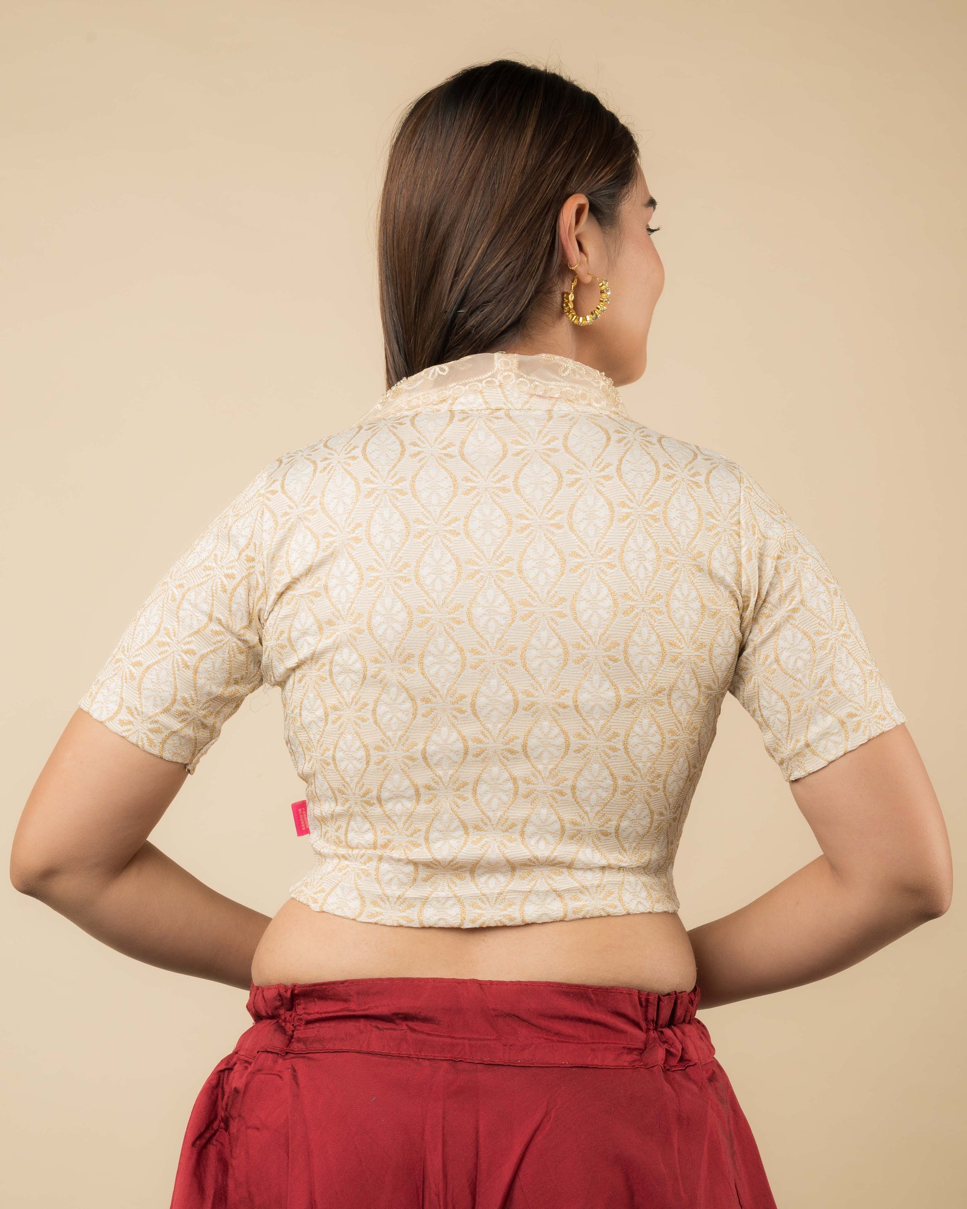 Rear view showcasing the collar’s embroidery and back design.