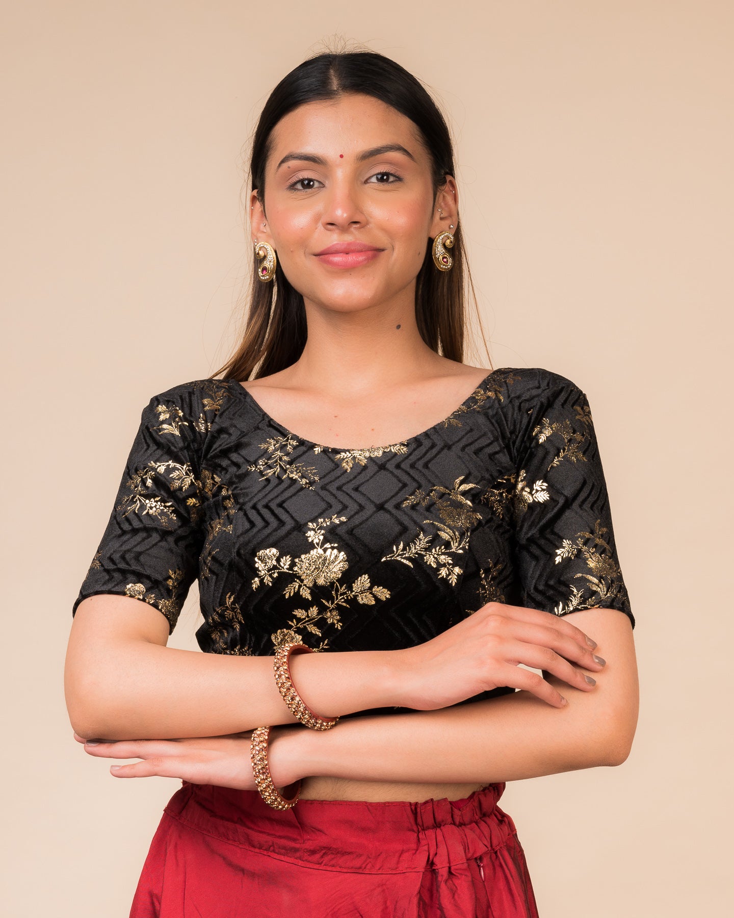 Model wearing a velvet stretchable blouse with elbow sleeves and sweetheart neckline featuring metallic floral print.