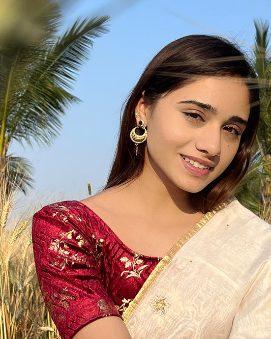Model paired the blouse with a saree for a festive-ready ensemble.