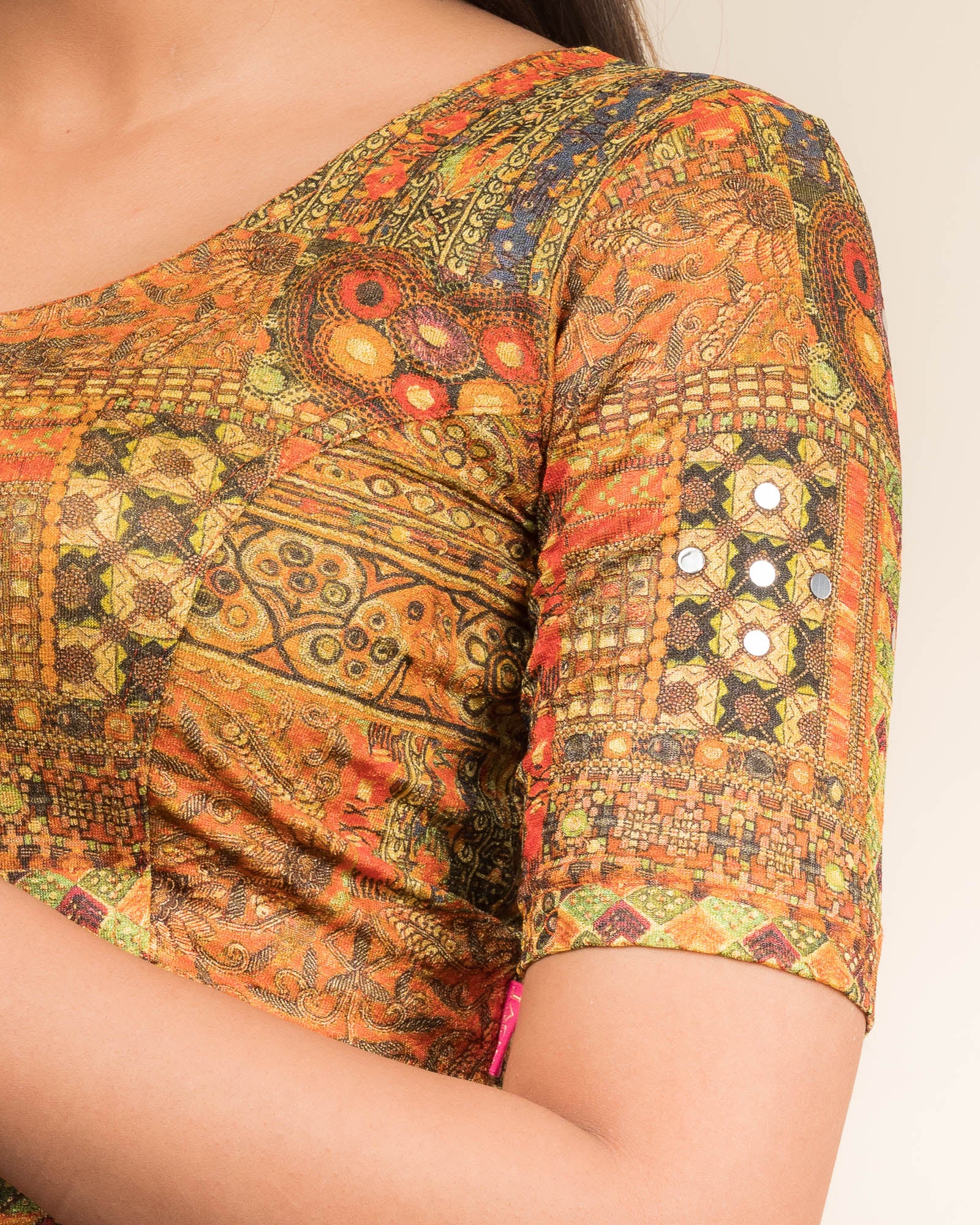 Close-up of the jacquard knit fabric with mirror and printed detailing.