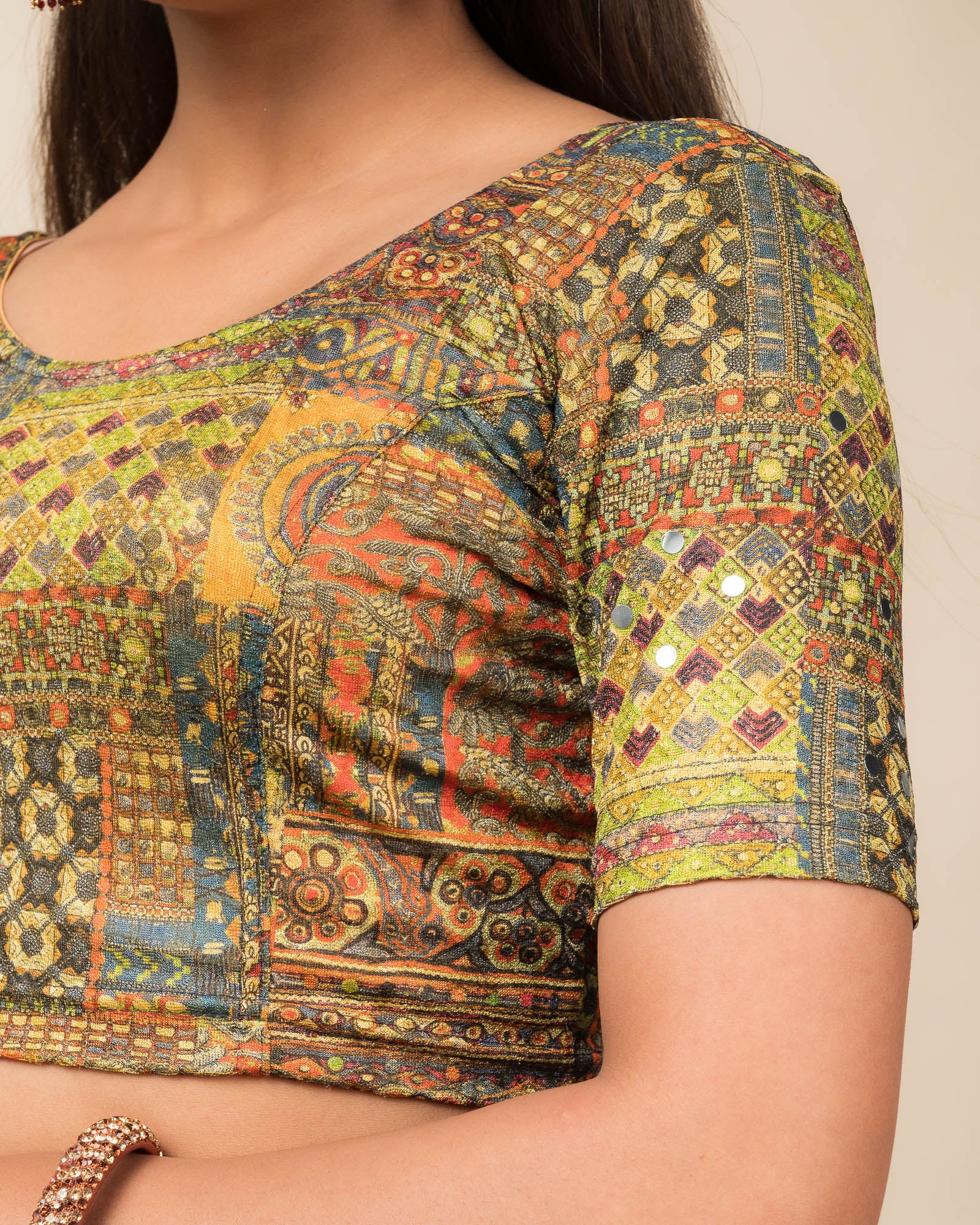 Close-up of the jacquard knit fabric with mirror and printed detailing.