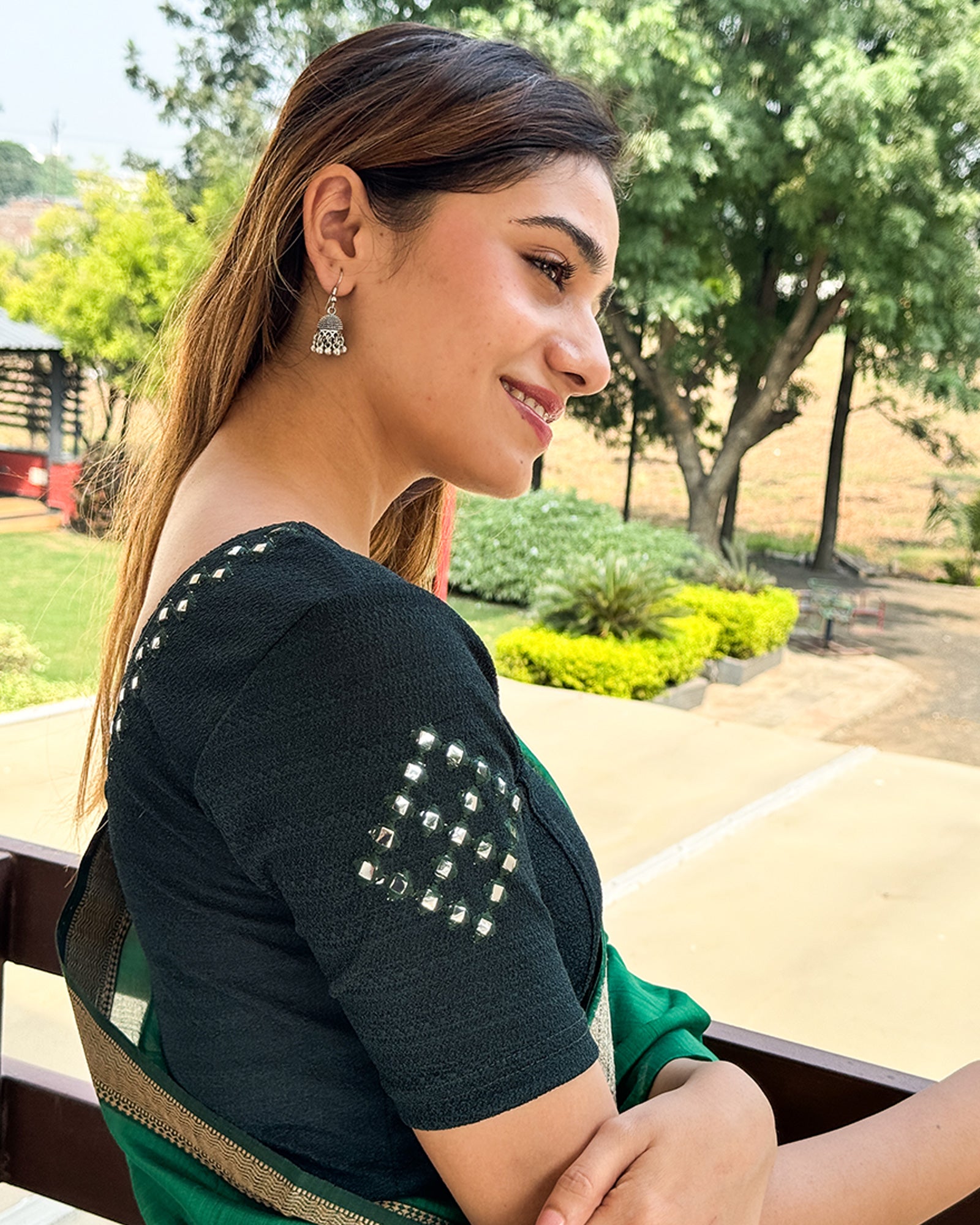 Side profile highlighting fit and sleeve structure.