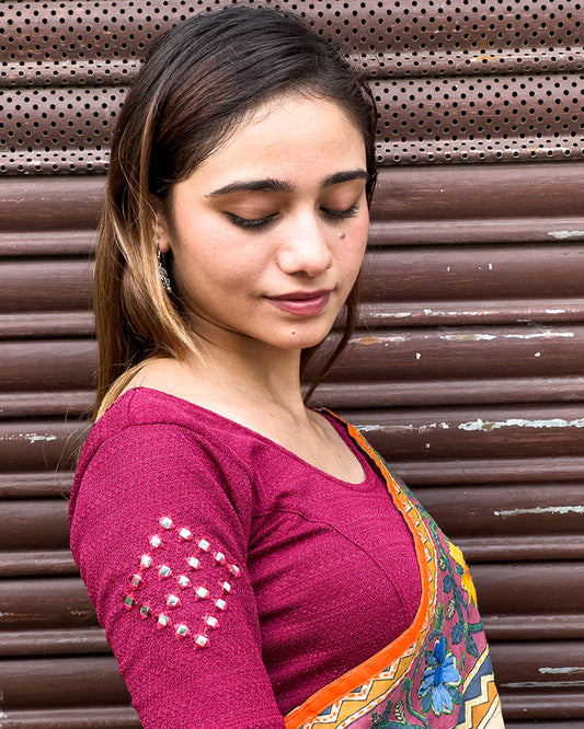 Model wearing the blouse with a saree for a festive ensemble ideal for Navratri.