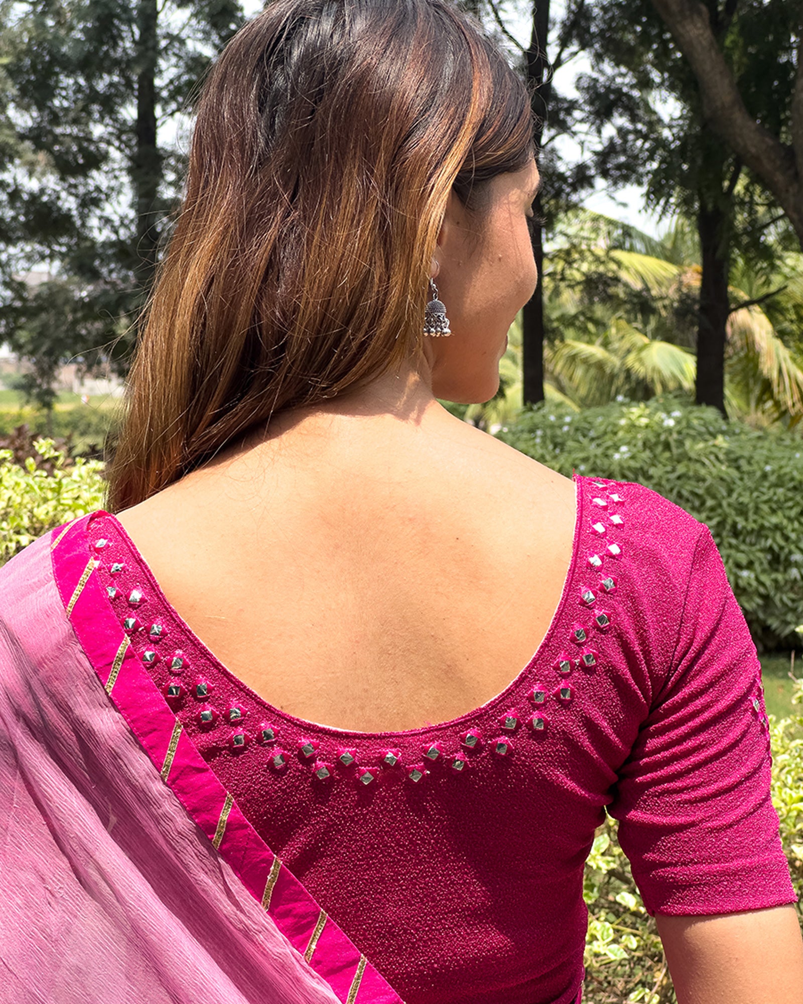 Rear view of the blouse showcasing the back design.