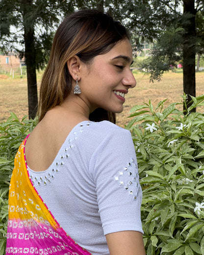 Model wearing the blouse with a saree for a festive ensemble ideal for Navratri.
