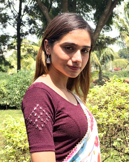 Model wearing the blouse with a saree for a festive ensemble ideal for Navratri.