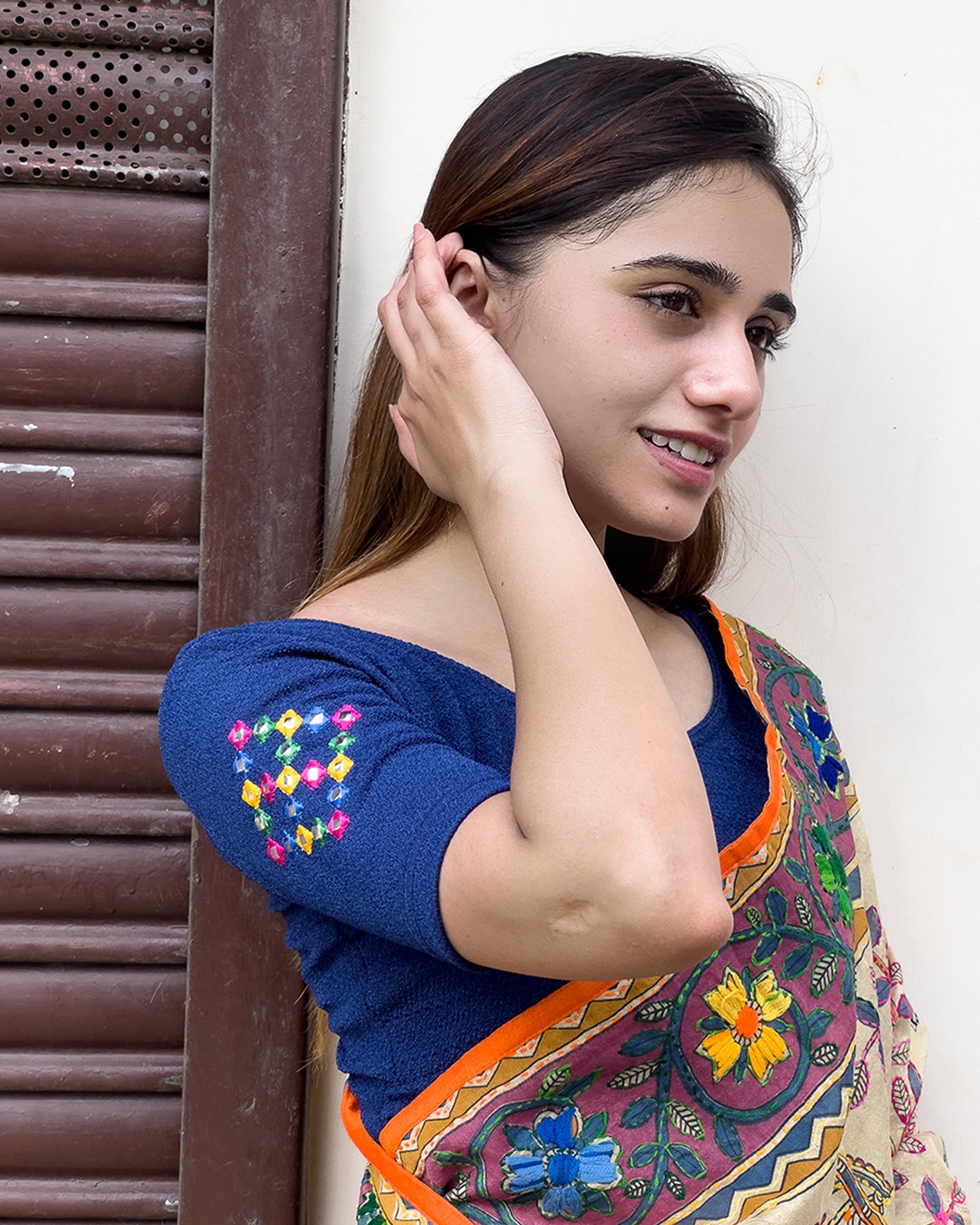 Model pairing the blouse with a saree, styled for festive occasions
