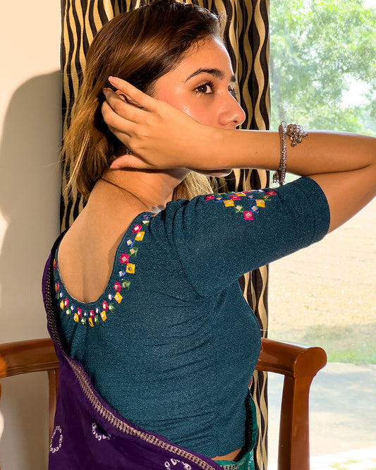 Close-up of jacquard knit with mirror and silk trim accents.