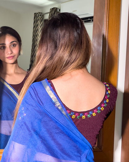 Rear view showcasing the embroidered details and back fit.
