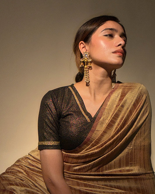 Model paired the blouse with a saree for a festive or evening occasion.