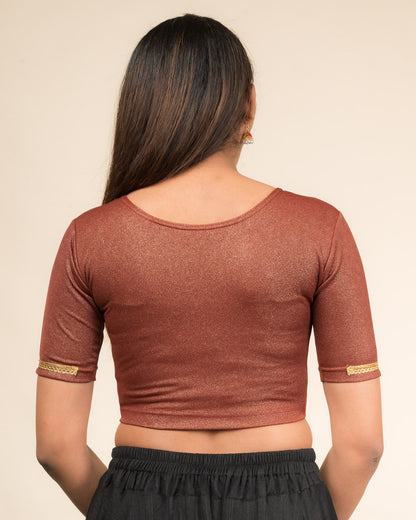 Rear view highlighting the blouse’s smooth back fit.