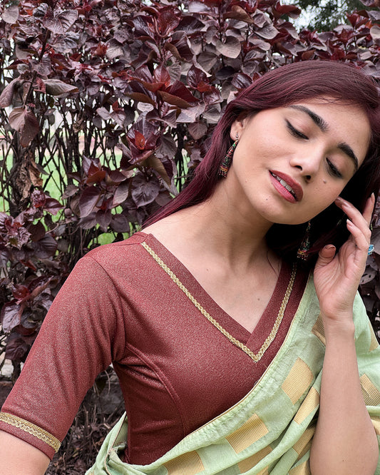 Model paired the blouse with a saree for a festive or evening occasion.