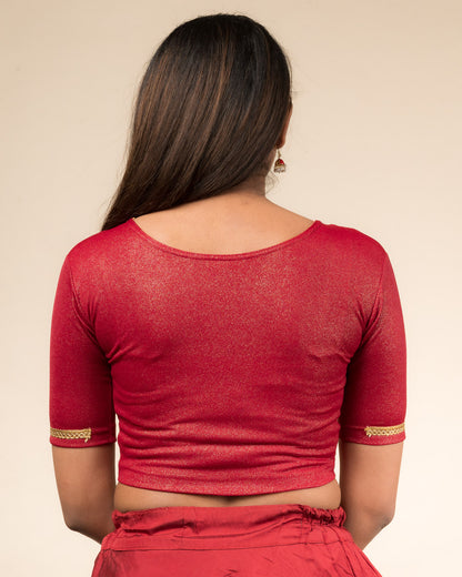 Rear view highlighting the blouse’s smooth back fit.