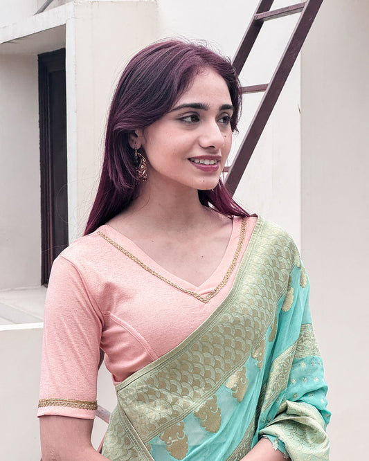 Model paired the blouse with a saree for a festive or evening occasion.