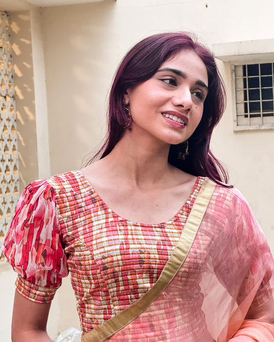 Model styled the blouse with a saree for a bold, festive look.