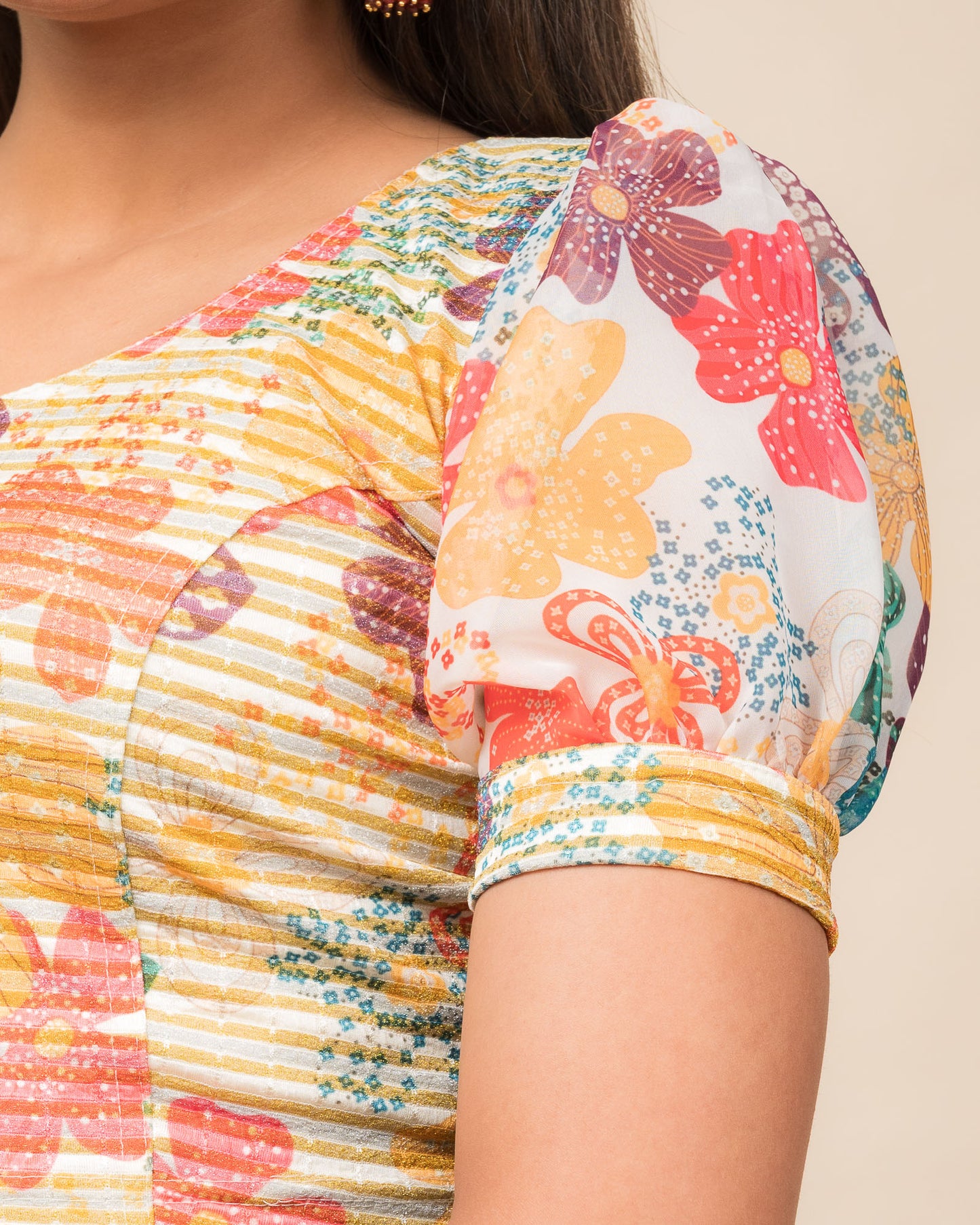Close-up showing printed texture and sheer organza detail.