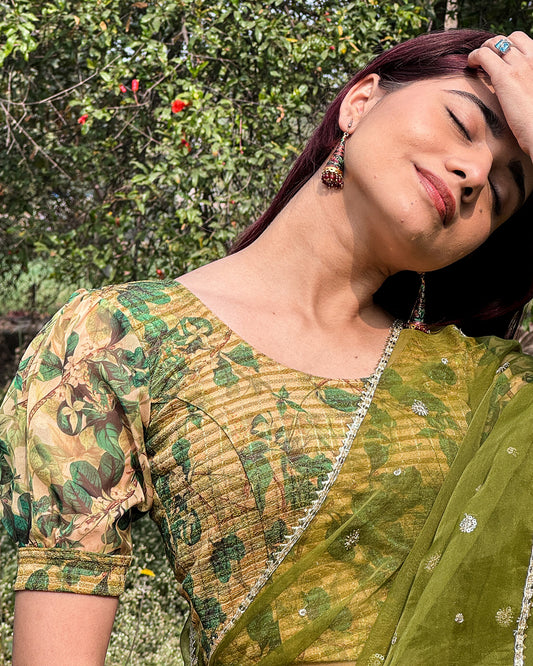 Model styled the blouse with a saree for a bold, festive look.