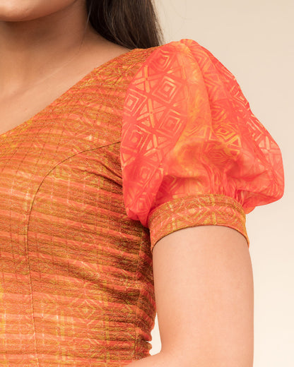 Close-up showing printed texture and sheer organza detail.