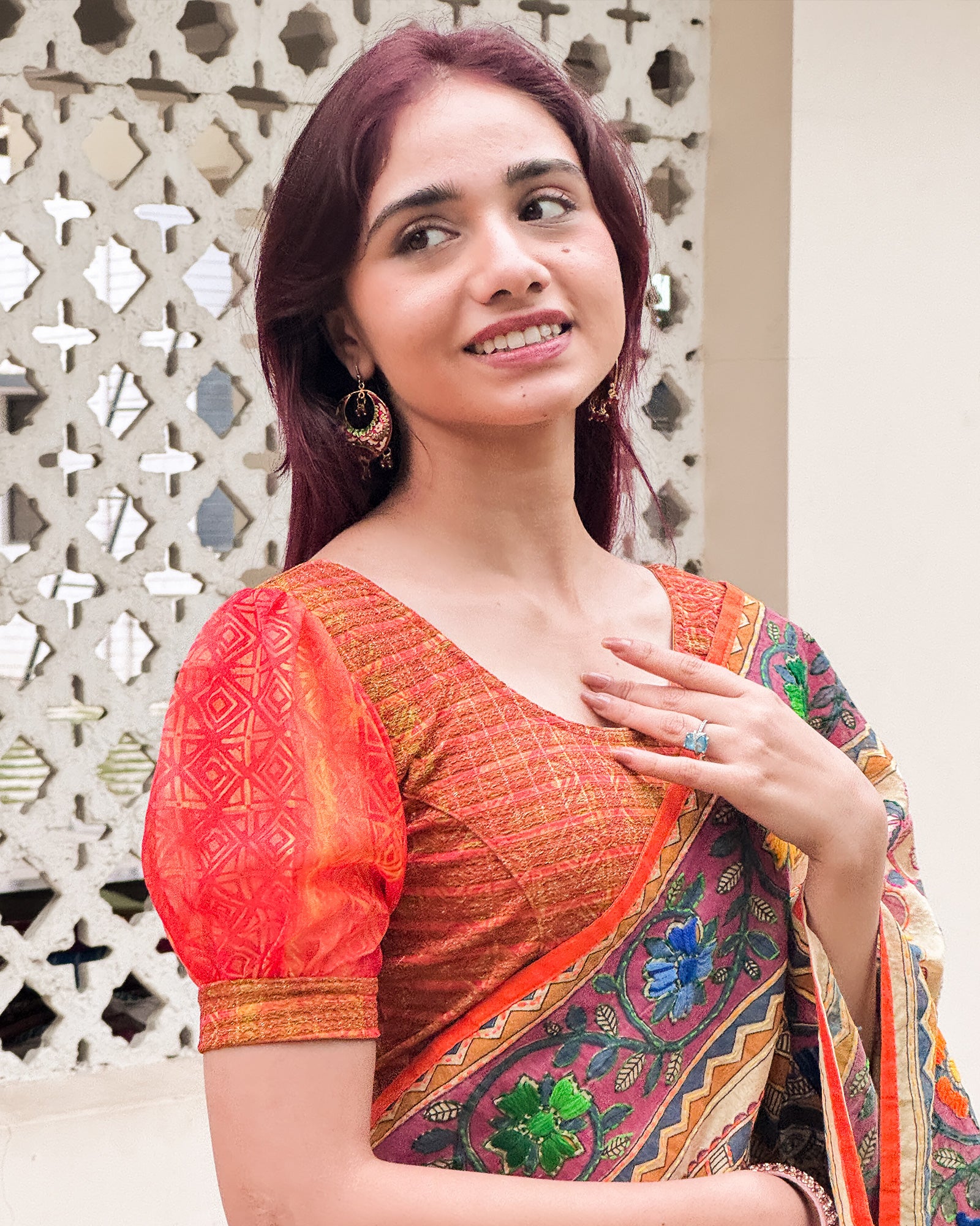 Model styled the blouse with a saree for a bold, festive look.
