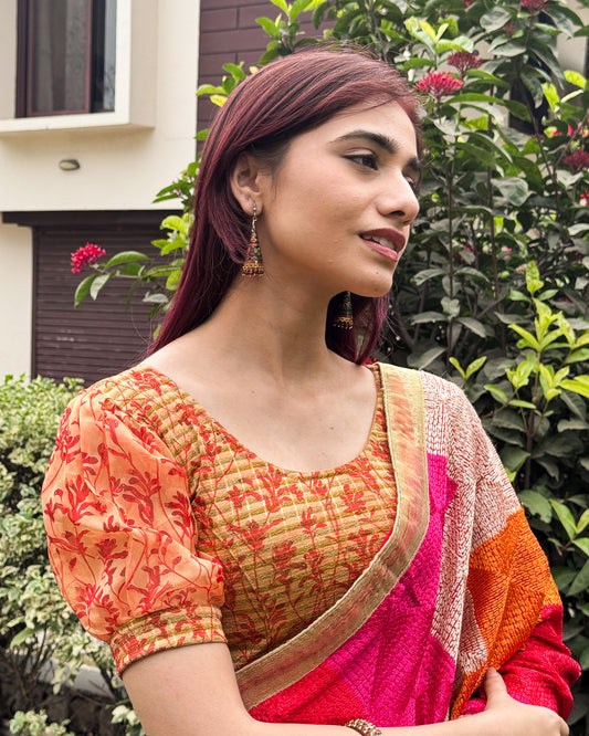 Model styled the blouse with a saree for a bold, festive look.