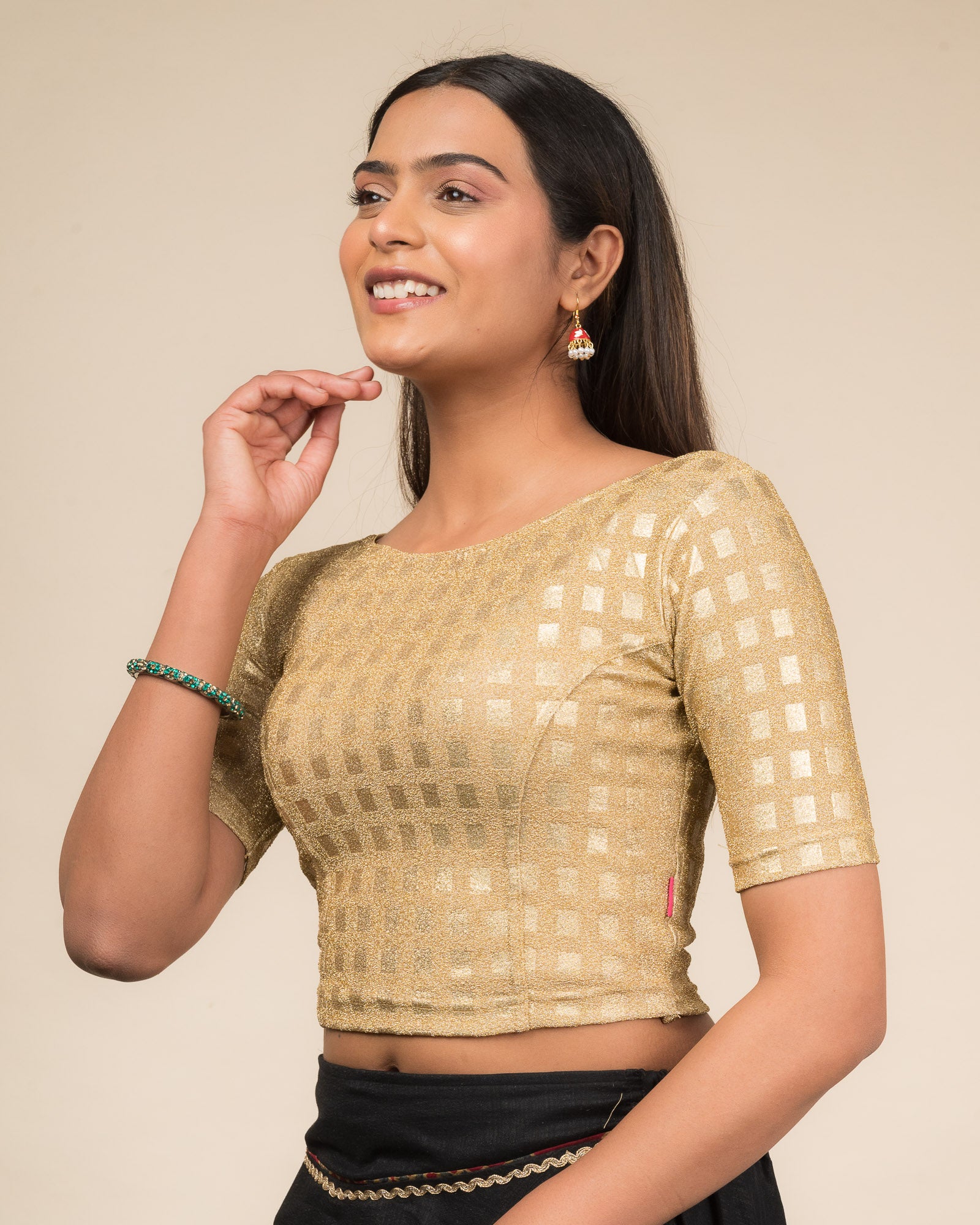 Side profile highlighting the silhouette and sleeve structure.