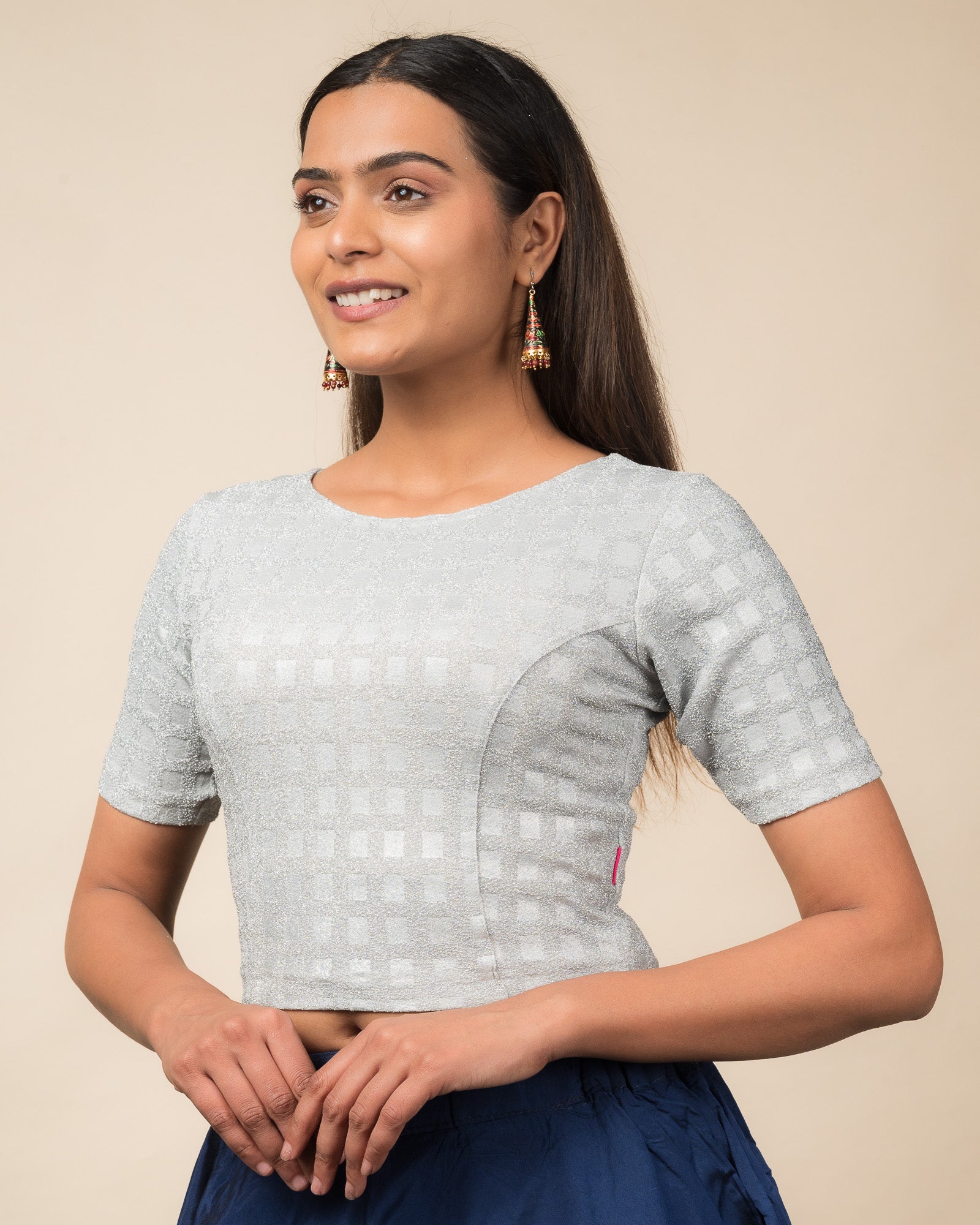 Side profile highlighting the silhouette and sleeve structure.