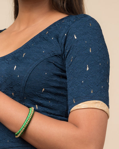 Close-up showing jacquard fabric with metallic drop accents.