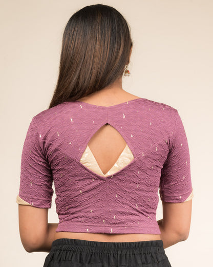 Rear view showcasing the artistically cut designer back design.