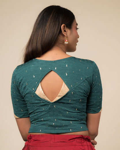 Rear view showcasing the artistically cut designer back design.