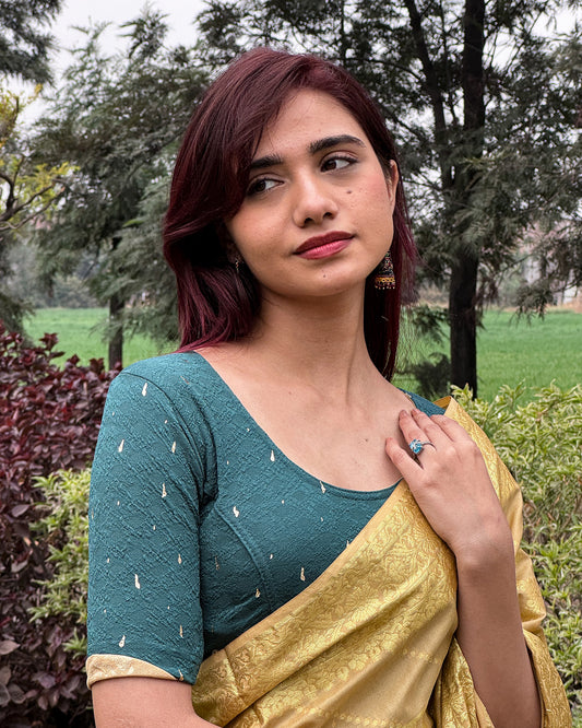  Model styled the blouse with a saree for an elevated festive look.
