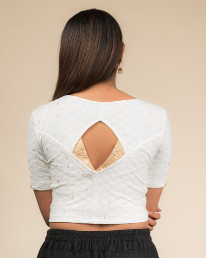 Rear view showcasing the artistically cut designer back design.