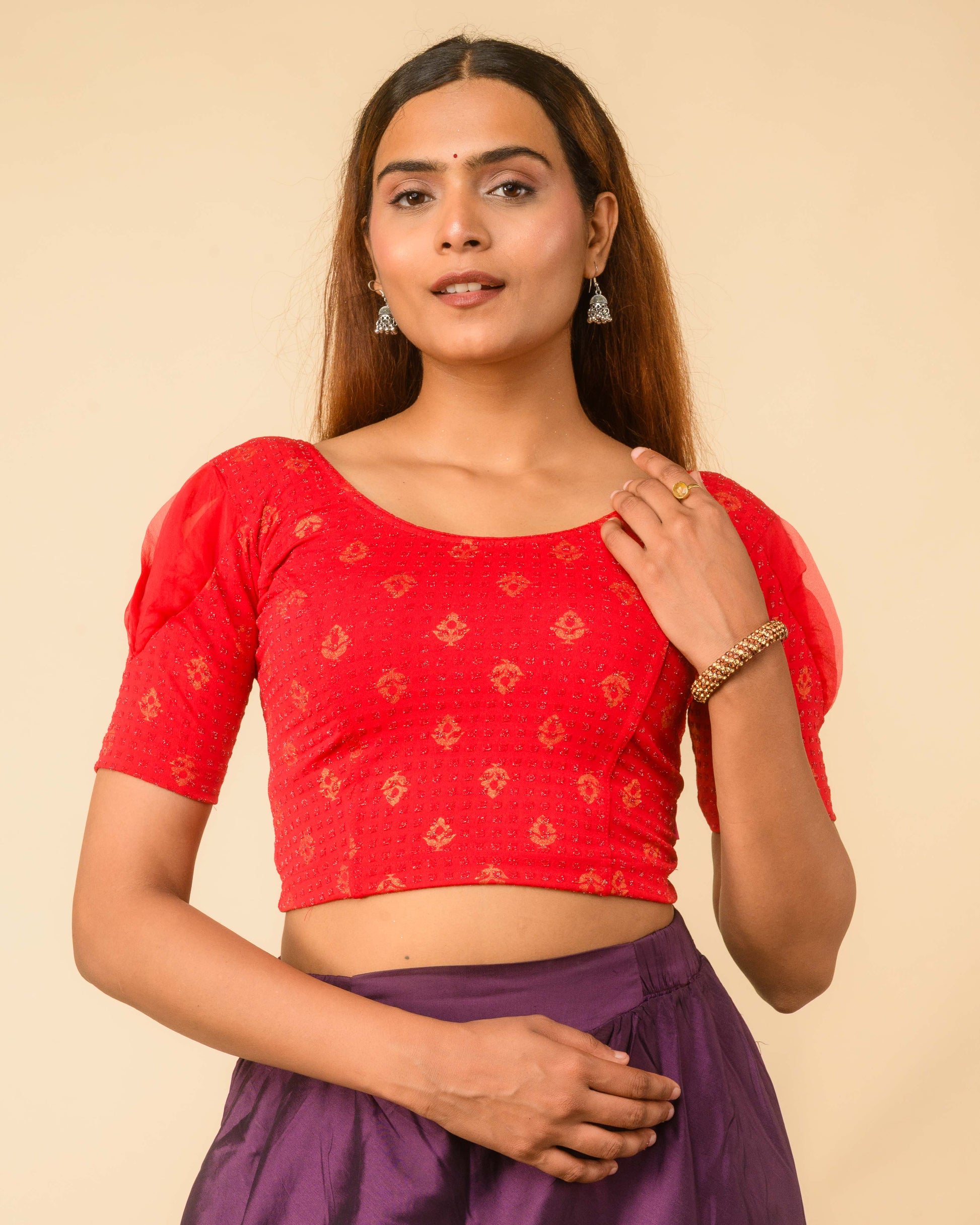 Paavna Gold–silver metallic buti Dobby Zari Jacquard stretchable saree blouse with organza puff elbow sleeves and round neck, by Advi, red front