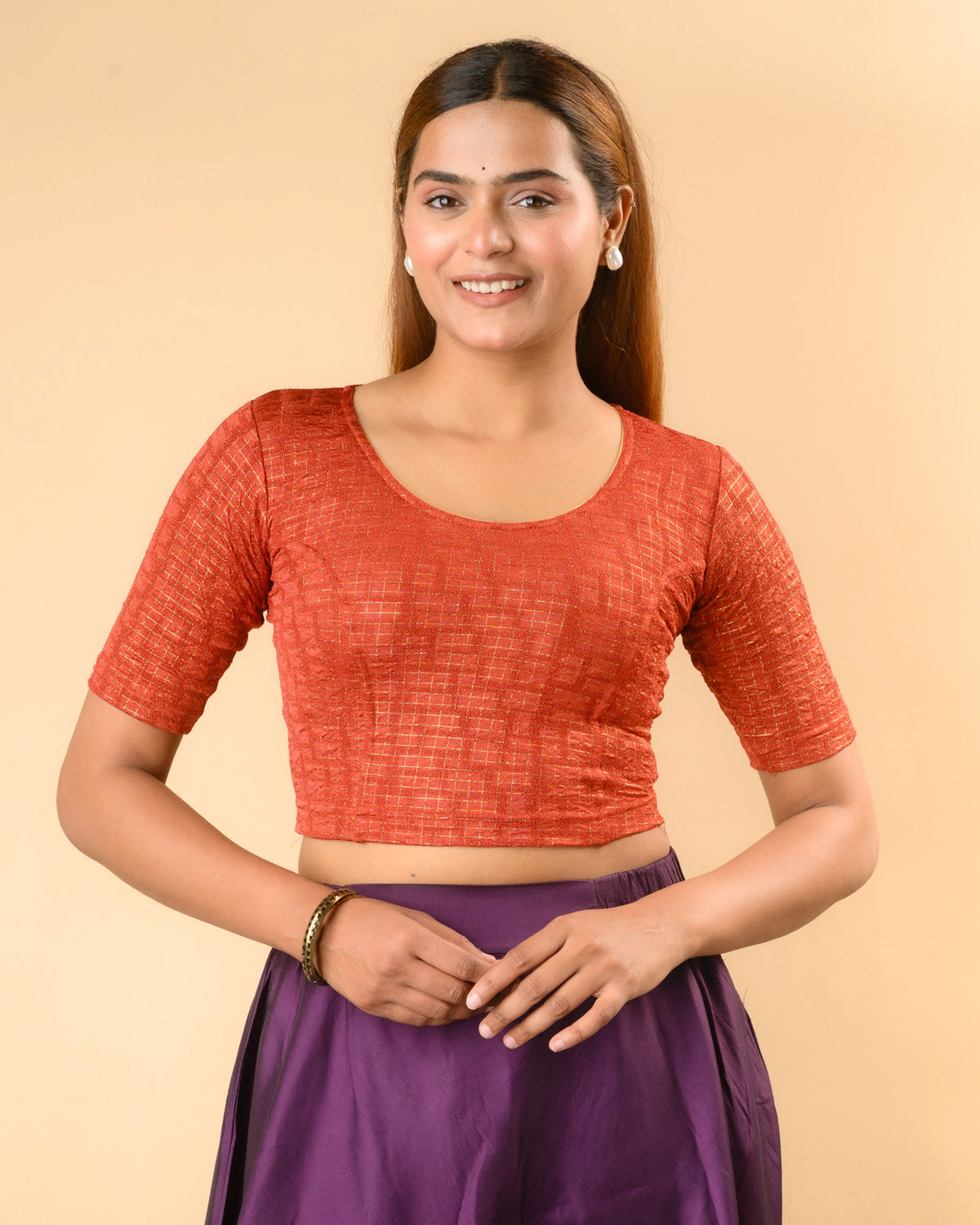 Padmaja Rust stretchable blouse with round neck and gold check jacquard by Advi - front