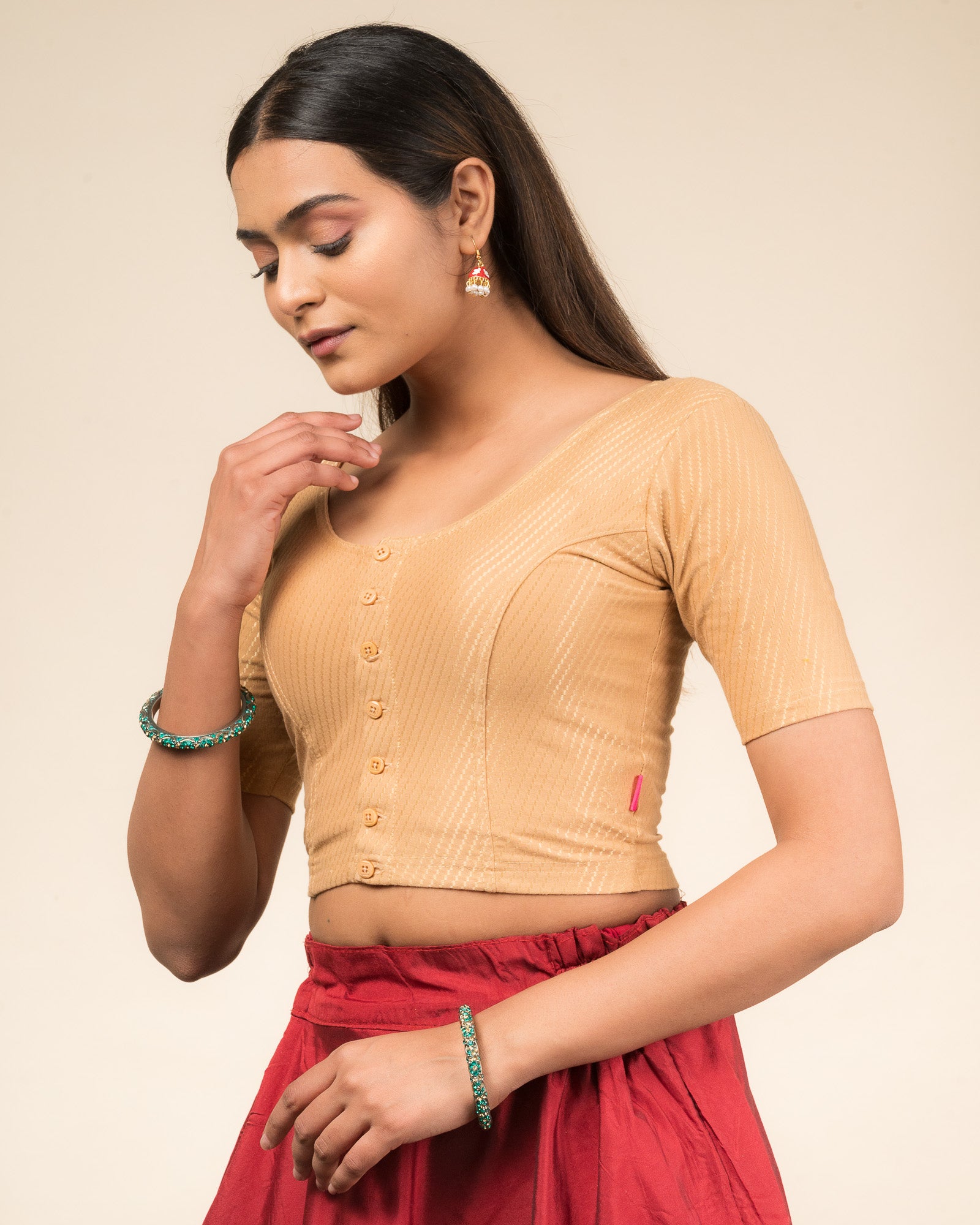  Side profile highlighting the sleeve length and silhouette.