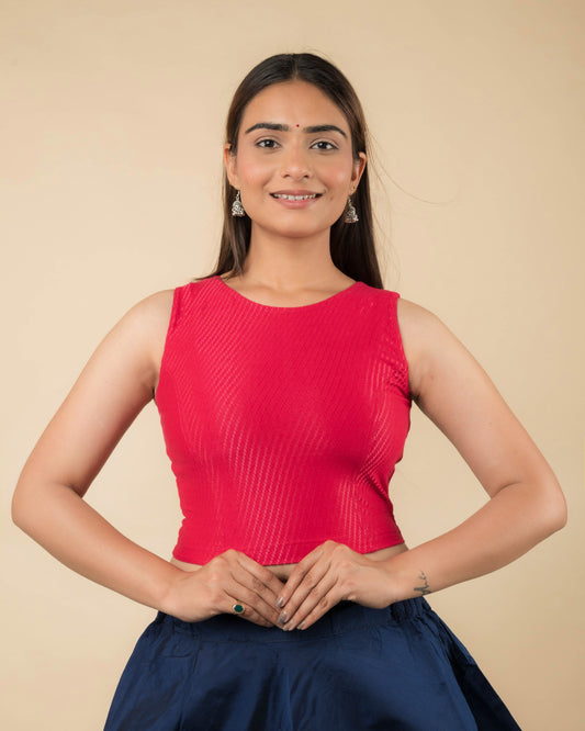Model wearing a sleeveless stretchable cotton blouse with high neckline