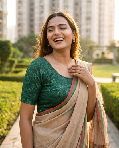 Daisy bottle green embossed floral glitter blouse styled with a saree by Advi - lookbook