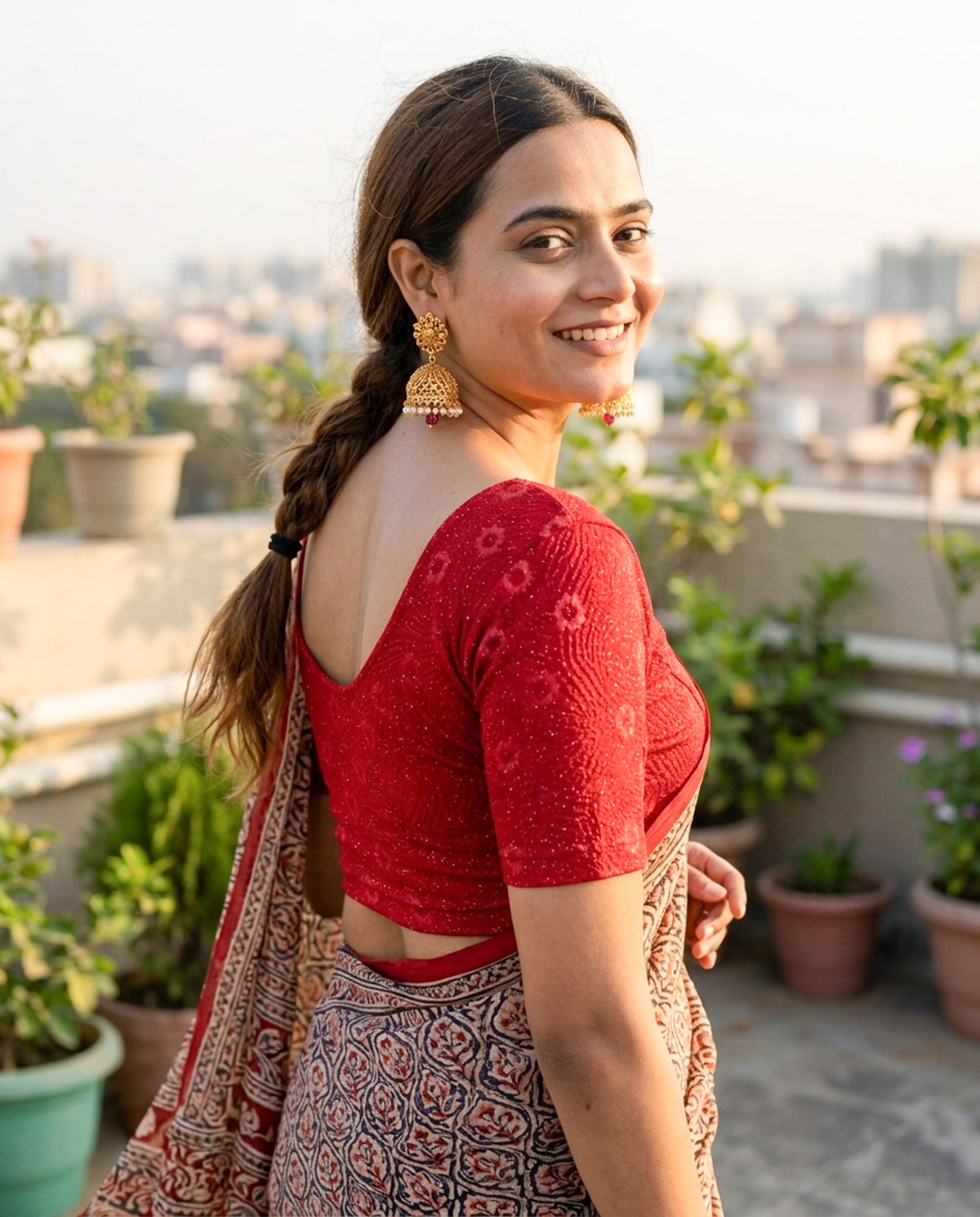 Daisy maroon embossed floral glitter blouse styled with a saree by Advi - lookbook
