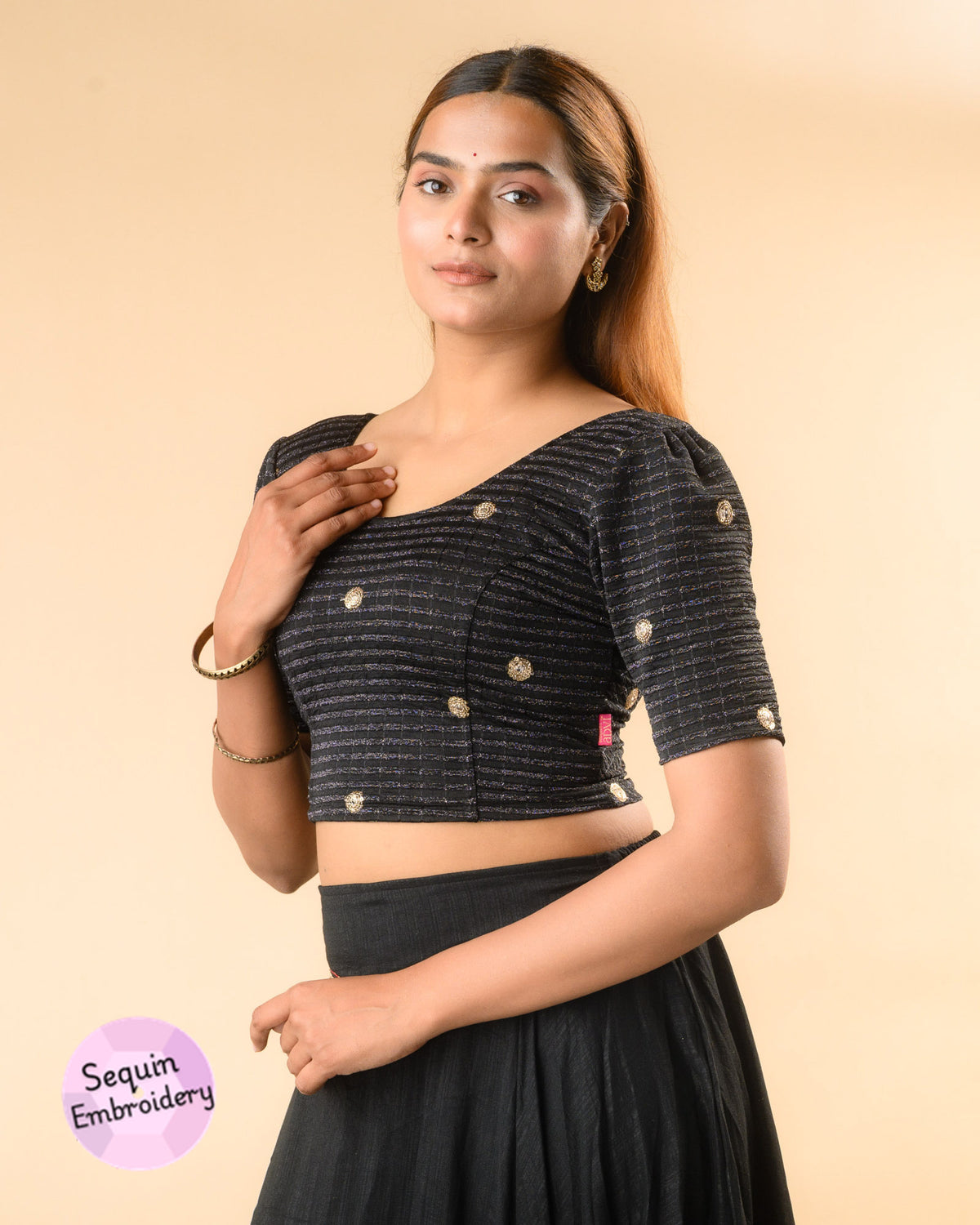 Damini black blouse showing the soft puff sleeve by Advi - side